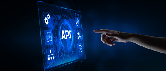 API Application Programming interface software web development concept. Hand pressing button on screen.