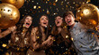 Exuberant friends laugh and celebrate with gold balloons and falling confetti.