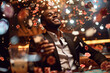 © igorfrost - young african man sitting at casino table with many poker chips flying around and drink, black male gambling and winning, looking confident and handsome, gamble establishment concept