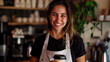 Portrait of smiling barista in a cafe