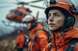 Close-up of a dedicated female search and rescue worker with a helicopter in the misty background