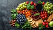  Arranged on slate, black background, fruits, veggies, crackers, platter