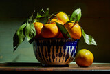 Fototapeta  - Fresh organic tangerines with leaves in bowl in bright sunlight with copy space. Still life with natural tropical fruit.