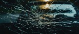 Fototapeta  - A car's broken glass window with a vehicle in the background
