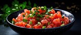 Fototapeta Uliczki - Bowl of fresh food featuring tomatoes and herbs