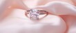 © Ilgun - A diamond ring on pink silk