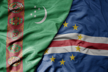 big waving national colorful flag of cape verde and national flag of turkmenistan.