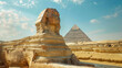 Picture the majestic Great Sphinx standing proudly against the backdrop of the timeless pyramids of Menkaure and Khafre on a clear, sunny day in Giza, Cairo, Egypt. The ancient monuments bask