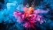 A vivid explosion of CMYK-colored holi paint powder isolated against a dark background, symbolizing the colorful and dynamic world of printing and manufacturing