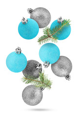 Wall Mural - Different Christmas balls and fir tree branches falling on white background