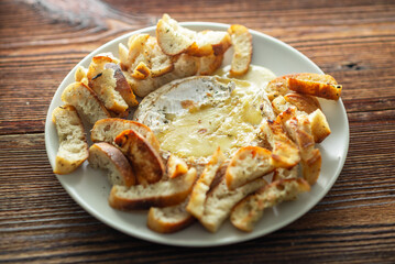 Wall Mural - A plate of bread and cheese with a white plate