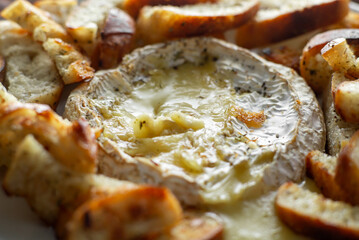 Wall Mural - A cheese ball is surrounded by bread and other food items