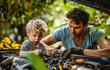 © Констянтин Батыльчук - Man and young boy looking under the hood of car together.
