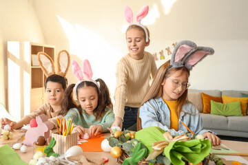 Sticker - Little children in bunny ears making Easter crafts at table