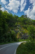 An asphalt road passing through the picturesque landscapes of Montenegro. Travel and vacation concept.