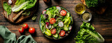Fototapeta Niebo - Salad bowl. Fresh vegetables salad cooked of lettuce leaves, cucumber, radish and tomatoes, banner stock image