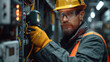 © bird_saranyoo - A professional electrician is measuring the current flow in an electrical panel using an ammeter.