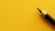 © Artyom - A sharpened black pencil placed diagonally on a vibrant yellow backdrop