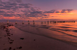 Fototapeta Konie - Colorful sunset.. Evening light on the fishing pier in Fort Myers Beach.