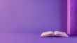 An open book on a minimalist purple background with a soft light