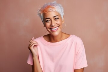 Sticker - Portrait of a beautiful middle aged woman in pink t-shirt