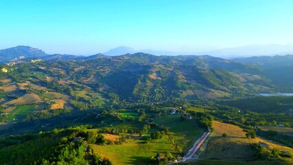 Wall Mural - Enchanting aerial push-in shot from Montefalcone Appennino (Fermo) slowly encompassing the momentous and mysterious Marche hilly mountainous landscape and Mount Ascensione, from a high vantage point