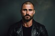 © Inigo - Portrait of a brutal man in a leather jacket on a dark background.