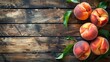 Fresh and large peaches placed on a wooden surface.