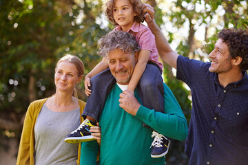 Poster - Big family, garden and happiness with child, nature and sunshine with weekend break or bonding together. Parents, grandfather and dad with mother and kid for joy and summer with fun, love or backyard