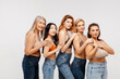 © Maria Vitkovska - Modern diverse, multiracial group of women wearing sexy bras and jeans hugging, looking at camera
