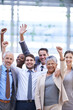 © YATrainer/peopleimages.com - Happy business people, portrait or cheers for goals with collaboration target, success or teamwork. Hands up, profit bonus or excited employees winning in corporate with group, welcome or achievement