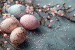 © Violetta - Pastel Easter eggs with dots, alongside white cherry blossoms on a textured grey surface.