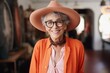 Portrait of a happy senior woman wearing hat and eyeglasses