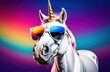 Funny unicorn wearing sunglasses in studio with a colorful and bright background.	
