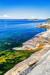 Wall Mural - Rocks by the water on a sunny summer day at an archipelago