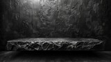 Dark stone bench illuminated by overhead light in dim room - B&W photo