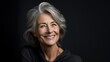 © Zainab - Adult woman with smooth healthy face skin. Beautiful aging mature woman with gray hair and happy smiling touch face, black background