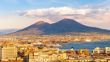 Wall Mural - urban view on a Naples city with houses buildings and mount Vesuveus with amazing cloudy sky on background of landscape