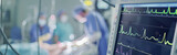 Fototapeta  - Surgeons performing operation in operating room at hospital. Group of surgeons in operating room with surgical equipment. Medical background
