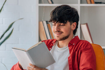 Poster - young man reading a textbook