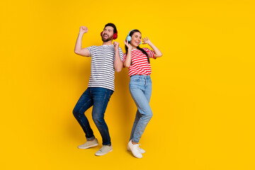 Sticker - Full body portrait of two cheerful people enjoy music dancing empty space isolated on yellow color background