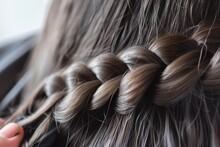 Closeup Of Hair Being Combed Into A Braid