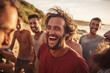 a group of adult men laughing on the beach having a good time with friends