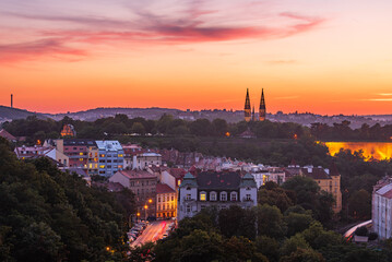 The Vysehrad hill in UNESCO site Prague in an orange dusk.