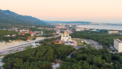 Wall Mural - Gelendzhik, Russia. Cathedral of St. Andrew the First-Called. The text at the entrance to the city is translated as Gelenzhik-City Resort. Sunset time, Aerial View