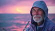 Elderly fisherman with a serene smile at dusk by the sea