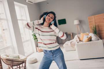 Sticker - Photo of positive cheerful lady dressed striped pullover having fun enjoying music headphones indoors apartment room