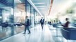© FoxTok - Blurred business background. Walking businessmen in a modern glass office center, shopping mall, bank. Movement effect, stylish interior with green plants