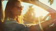 Sun-kissed woman enjoys a serene drive, the essence of freedom on a coastal road.