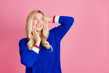 Poster - Photo of pretty lady touch hair look empty space wear blue sweater isolated on pink color background